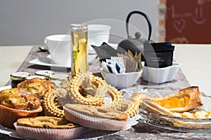 Full breakfast table ready to be served in a hotel
