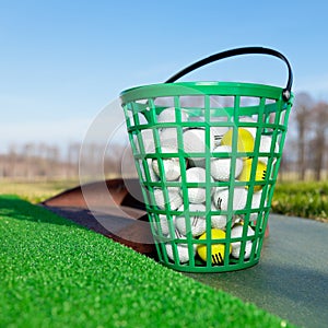 A full bucket of golf balls