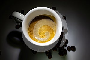 Full coffee cup on dark background