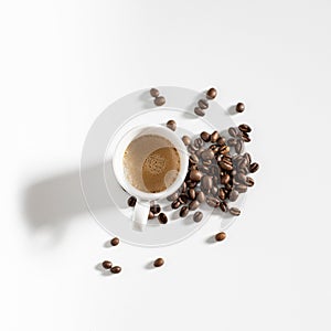 Full coffee cup on white background with beans
