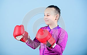 Full concentration. Happy child sportsman in boxing gloves. Sport success. sportswear fashion. workout of small girl