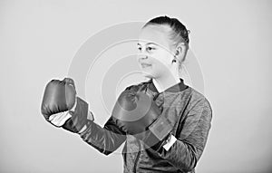 Full concentration. Happy child sportsman in boxing gloves. Sport success. sportswear fashion. workout of small girl