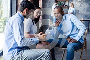 Full concentration at work. Corporate team working colleagues working in modern office.