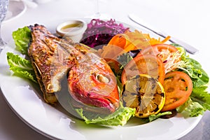 Full Cooked Tilapia Served with Vegetables and Fish Sauce