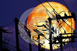 full crust moon back on silhouette power electric line on night sky