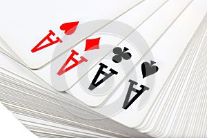 Full deck of playing cards with four aces on top
