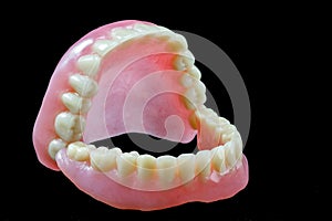 Full denture on black background