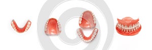 Full denture close-up. Dentures. Full removable plastic denture of the jaws. Upper and lower jaws with fake teeth