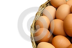 Full of Eggs put in a wicker basket in white background (isolated)