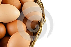 Full of Eggs put in a wicker basket in white background (isolated)