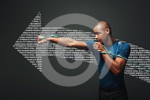 Full of energy. Sportsman working out with resistance band over dark background. Graphic drawing.