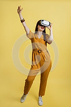 Full of expression. 3d technology, virtual reality, sport, entertainment and people concept. Pretty young woman wearing