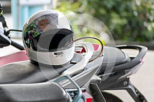 Full Face Helmet on the Seat of Light Weight Motorcycle