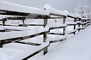 Empty corral on a beautiful snowy winter day