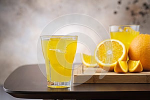 Full fizzy lemonade glass with ice cubes