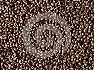 Full frame of aromatic roasted coffee beans background