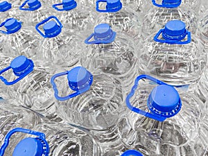 full frame background of transparent plastic 5 liter bottles of clear water