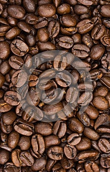 Full frame close-up of roasted coffee beans, perfect for a rich background