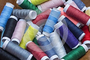 Full frame of colorful sewing thread spools