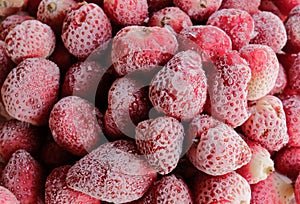 a full frame of frozen strawberries