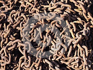 tangled pile of old rusty steels chains