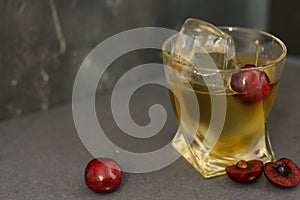 Full Frame image of two Glasses of Sangria on a Multicolored Cloth with Lady Palms in the Background.