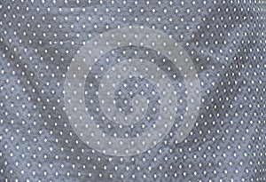 Full frame indigenous fabric pattern with white dots on a black background