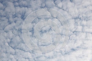 Full frame of pretty blue sky with unusual scudding cloud formation