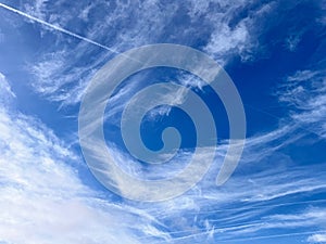 Full frame of pretty blue sky with unusual scudding cloud formation
