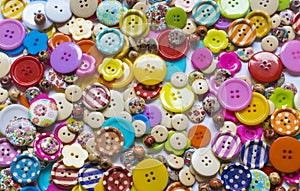 Full frame and selective focus photo of various and colorful sewing buttons