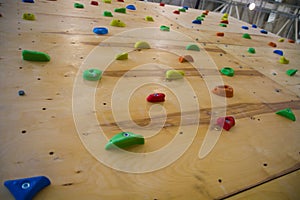 Full frame shot of the artificial climbing wall in the fitness club`s brightest studs