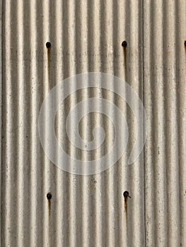 Full Frame Shot of Corrugated Asbestos tile board with rusty screws