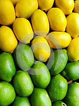 Full frame shot of green and yellow colors lemons