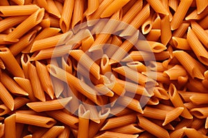 A full-frame shot of a raw Penne pasta background