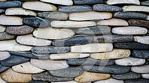 Full frame of small stones neatly arranged as a background