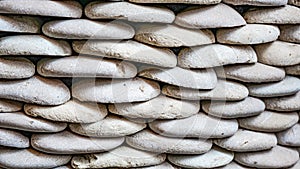 Full frame of small stones neatly arranged as a background