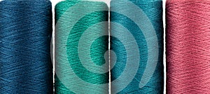 Full frame of spools with colored thread.