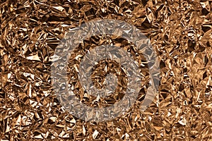 Full frame take of a sheeT of crumpled gold aluminum foil