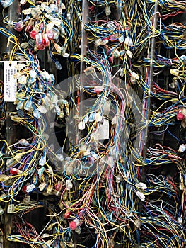 Full frame telecommunications background of a tangle of fibre optic wires with copy space