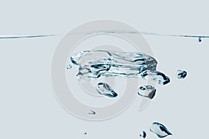 Air bubbles isolated on light blue background