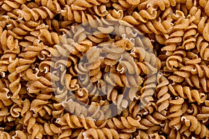 Full frame of wholegrain spiral pasta