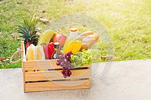 Full fresh vegetables and fruits in crate wood box