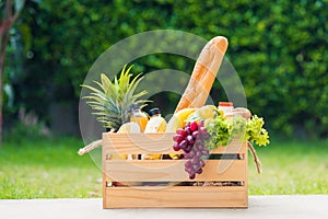 Full fresh vegetables and fruits in crate wood box