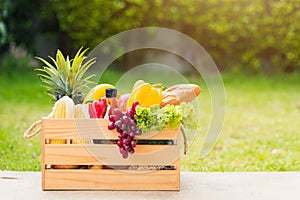 Full fresh vegetables and fruits in crate wood box