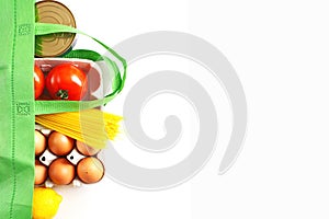 Full green bag of healthy products food on a white background. Top view. online shop. your text. food delivery