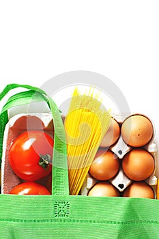 Full green bag of healthy products food on a white background. Top view. online shop. your text. food delivery