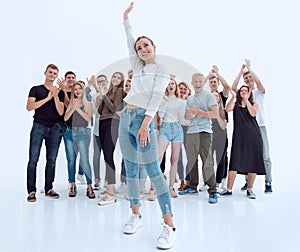 in full growth. affable young woman standing in front of a youth group