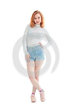 In full growth. confident model girl in jeans shorts