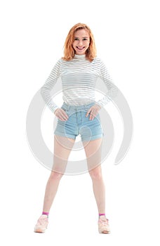 In full growth. confident model girl in jeans shorts