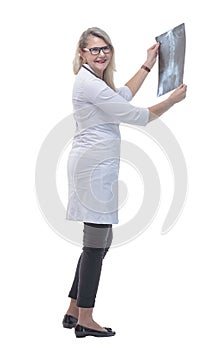 In full growth. female doctor looking at a lung x- ray